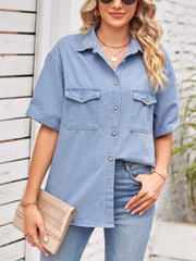 Relaxed light denim shirt jacket with cuffed sleeves and dual chest pockets.