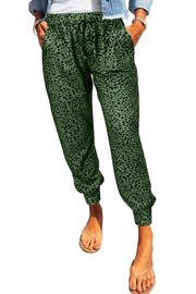 Green leopard print relaxed-fit drawstring trousers with cuffed ankles.