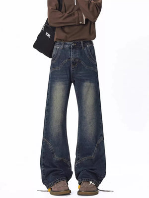 Men's vintage wash wide leg jeans with distressed details and a relaxed fit.