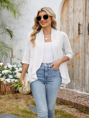 White eyelet cascade cardigan with open front and elbow-length sleeves.