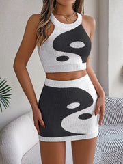 Yin Yang knit crop top and mini skirt set in black and white acrylic.
