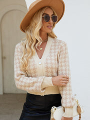 Tan houndstooth cropped cardigan with pearl button and V-neck.