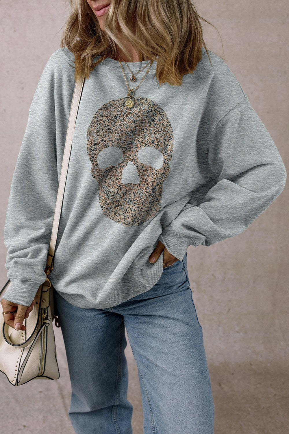 Gray cotton sweatshirt with embellished skull motif and crew neck.