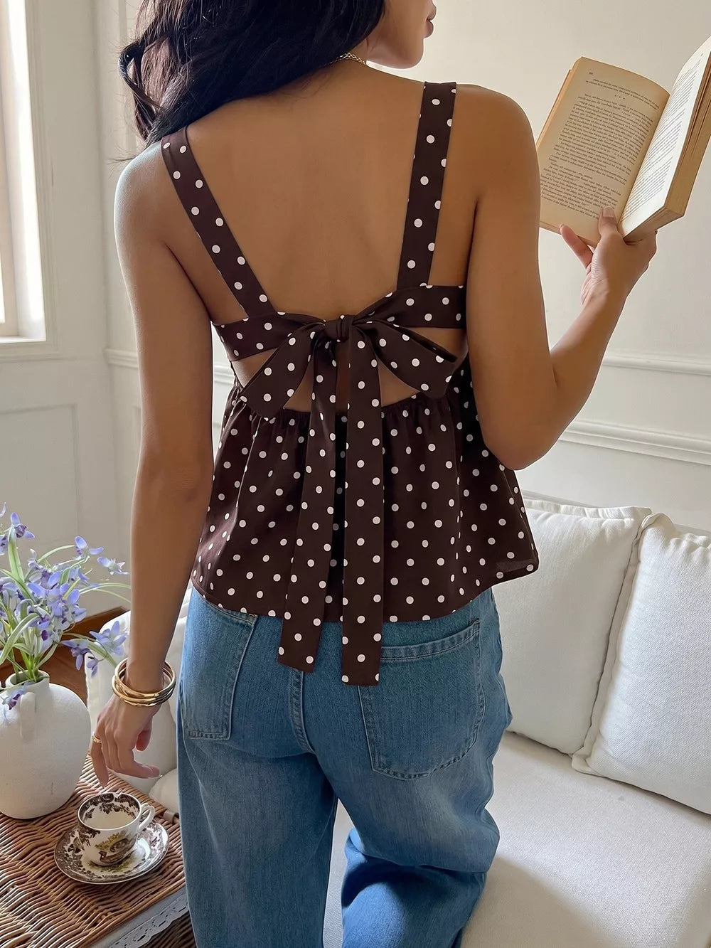 Brown polka dot cami with tie-back detail and open back.