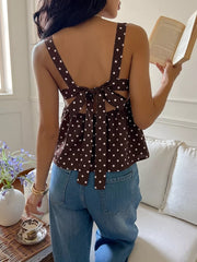 Brown polka dot cami with tie-back detail and open back.