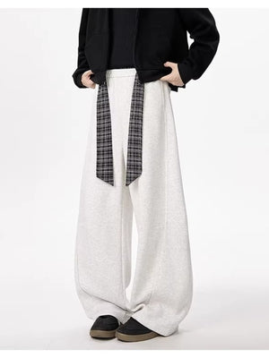 Light gray relaxed fit wide-leg sweatpants with a plaid tie belt.