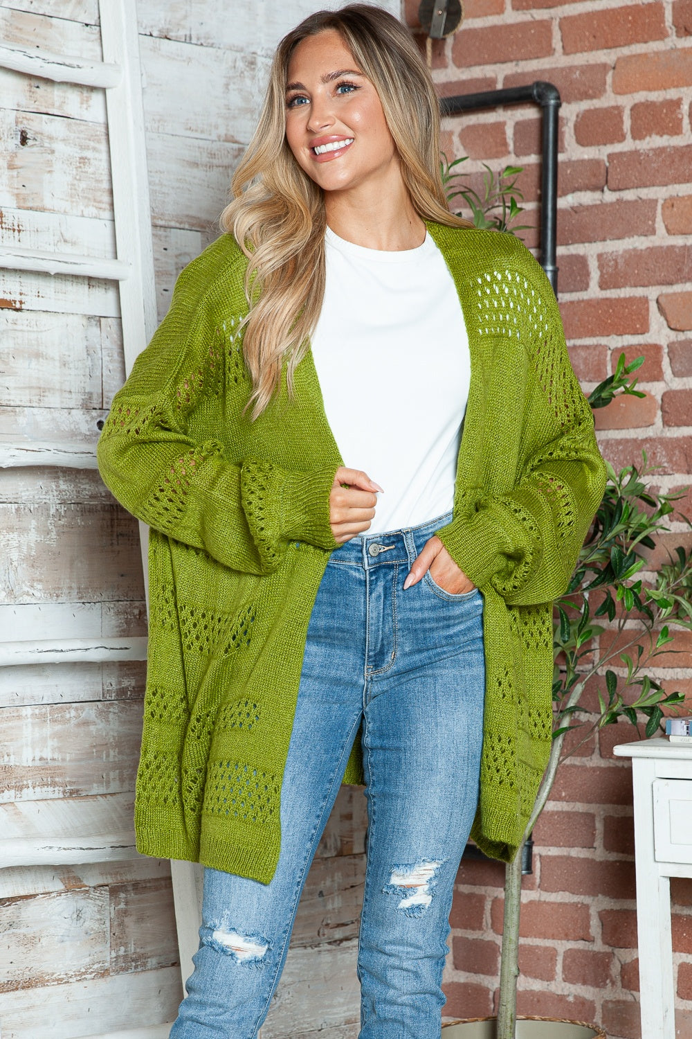 Open-knit slouchy cardigan in matcha green with a relaxed fit and open front.