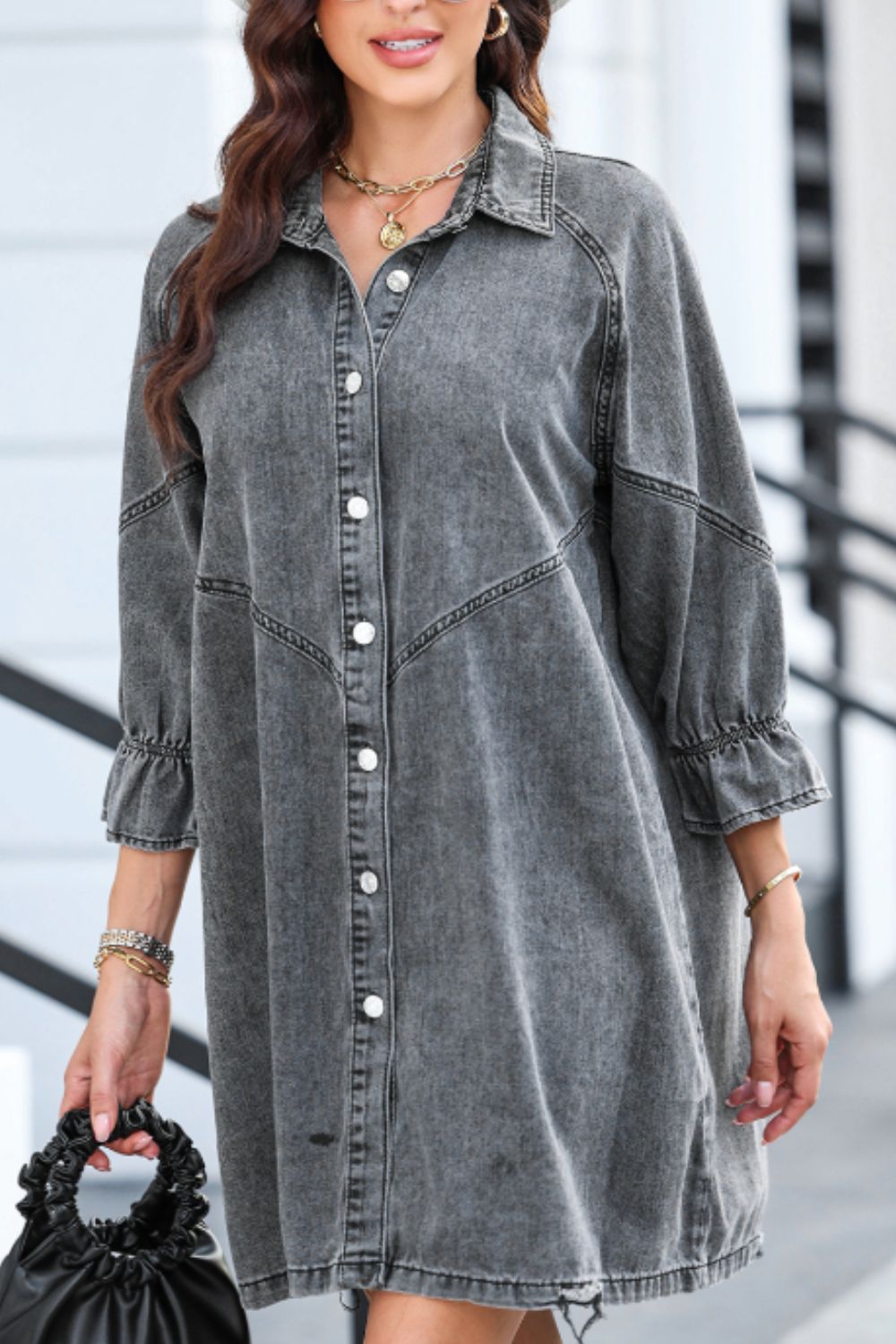 Gray denim shirtdress with button front and ruffled cuff detail.