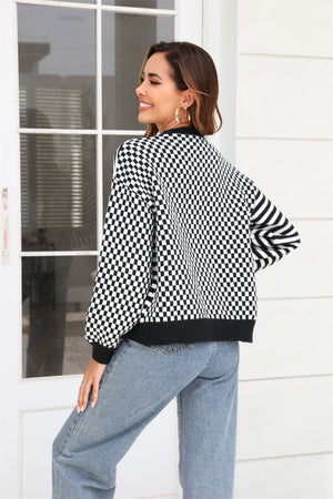 Checkerboard sleeve contrast cardigan in black with buttoned front and ribbed trim.
