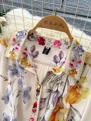 Vibrant floral midi dress with button front and lantern sleeves, featuring a colorful brocade print.