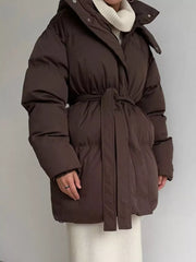 Dark brown belted puffer trench coat with hood and a tie waist.