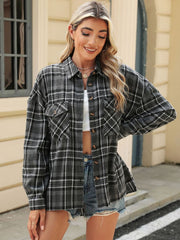 Gray plaid collared long sleeve shirt with button-down front and chest pockets.