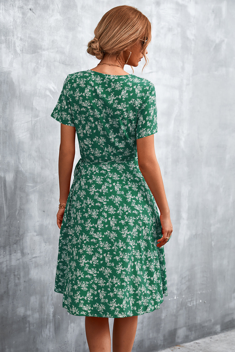 Crimson Floral Wrap Midi Dress in Light Green with short sleeves and a tie waist.