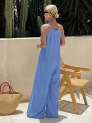 Blue tie-strap wide-leg romper with spaghetti straps and a relaxed fit.
