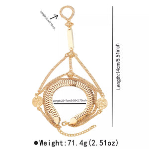 Gold multi-layered chain bracelet with coin charms and textured center band.