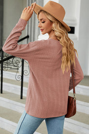Dusty Pink textured cable-knit henley pullover with button detail.