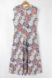 Floral cap-sleeve jumpsuit with a button-up front and wide legs.