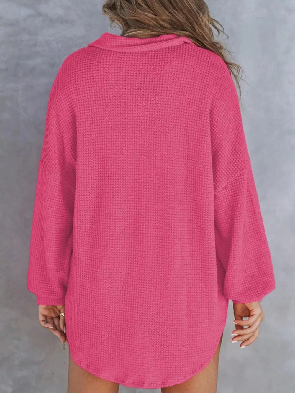 Waffle-knit Henley tee in dark pink with a collared neckline and long sleeves.