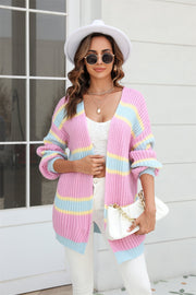 Open knit cocoon cardigan with rainbow stripes in pink, yellow, and blue acrylic.