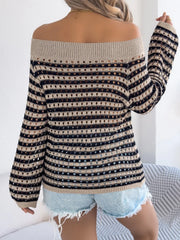 Off-shoulder striped mesh knit sweater with tan and black stripes and open knit details.