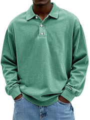 Men's vintage washed light green long sleeve cotton polo shirt with buttoned placket.