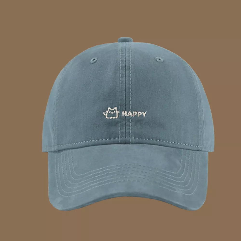 Mist blue cotton baseball hat with embroidered cat and happy graphic