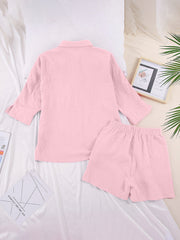 Pink gauze cotton resort shirt and shorts set with buttoned top and elastic waist shorts.
