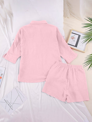 Pink gauze cotton resort shirt and shorts set with buttoned top and elastic waist shorts.