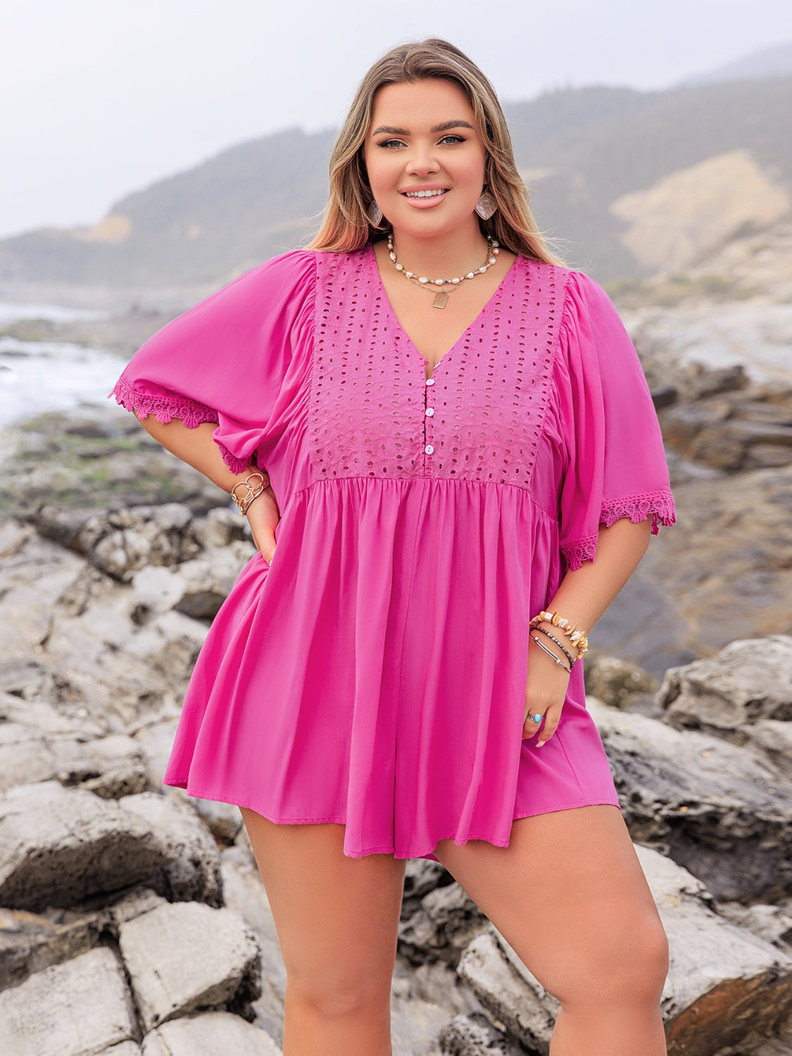 Hot Pink eyelet yoke romper with flutter sleeves and lace trim.