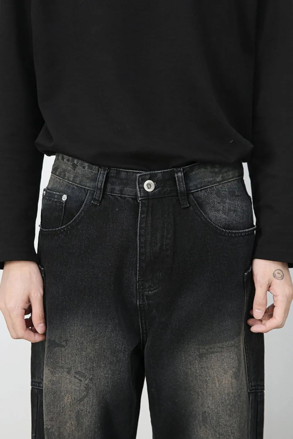 Dark wash wide leg denim jeans with faded details and distressed accents.