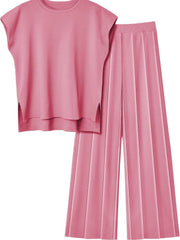 Seamed knit wide-leg co-ord set in Dusty Pink, featuring a cap-sleeve top with side slits and pleated pants.