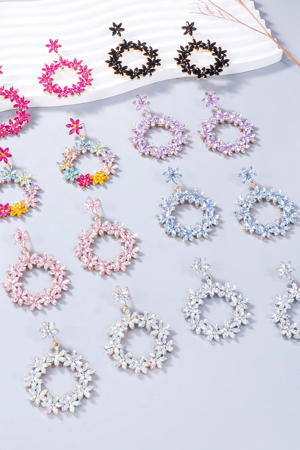 Floral halo drop earrings in multicolor, hot pink, white, pink purple, silver, light blue, blush pink, and black.