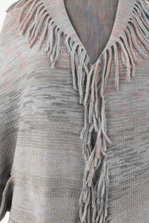 Textured stripe fringe cape in gray with subtle pink and blue threads, acrylic knit.