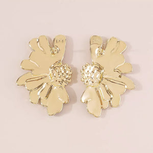 Textured gold flower stud earrings with detailed centers and petal accents.