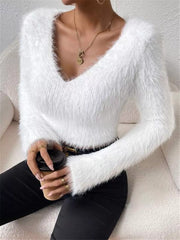 White fluffy v-neck knit sweater with long sleeves and a cozy texture.