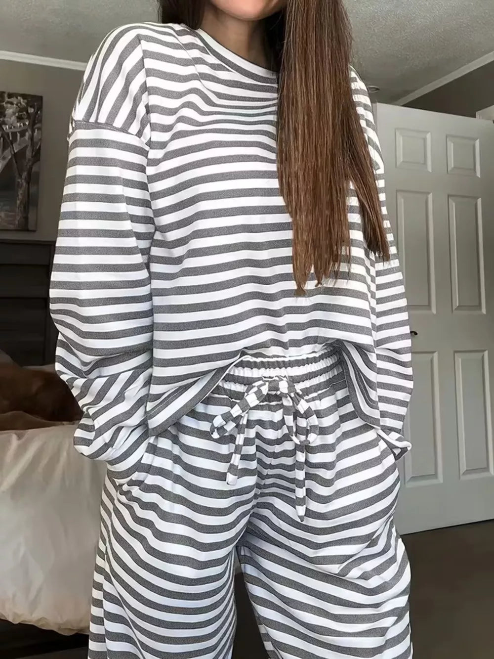 Light Gray striped pajama set with drawstring pants and long sleeve top.