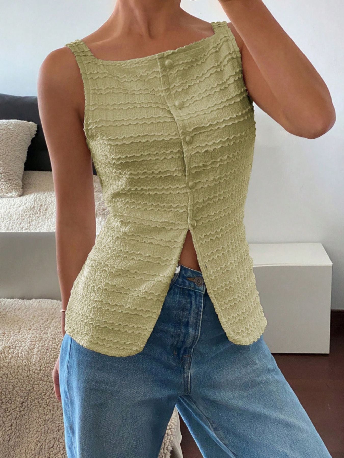 Yellow-green wavy textured button-front tank top with square neckline and split hem.
