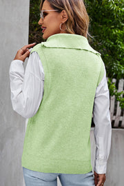 Yellow-green ribbed knit vest with collar and zip neck, layered over a white shirt.