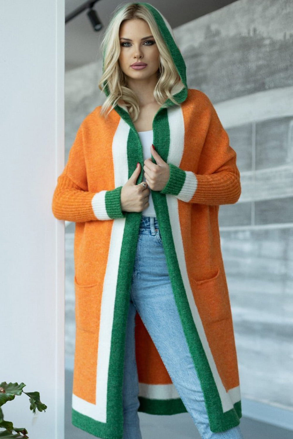 Orange hooded knit maxi cardigan with green and white color blocking, acrylic.