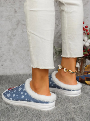 Blue snowman print sherpa lined holiday slides with white snowflakes and fuzzy trim.