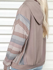 Relaxed fit hoodie with multi-tonal patterned sleeves and a taupe body.