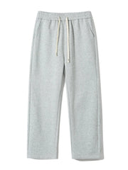 Gray sweatpants with drawstring waist and loose fit.