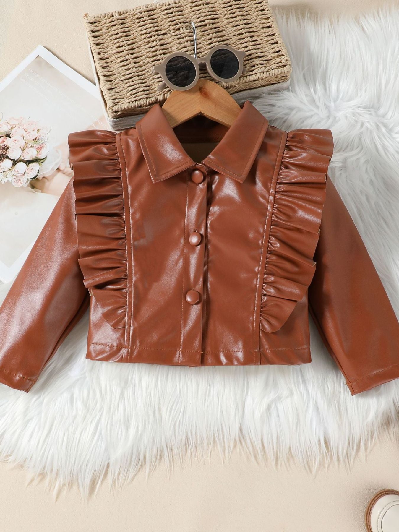 Brown faux leather toddler jacket with ruffled front and button closure