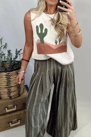 White knit sweater vest with cactus desert graphic, sleeveless, crew neck, relaxed fit.