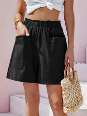 Black relaxed fit utility shorts with elastic waist and large front pockets.