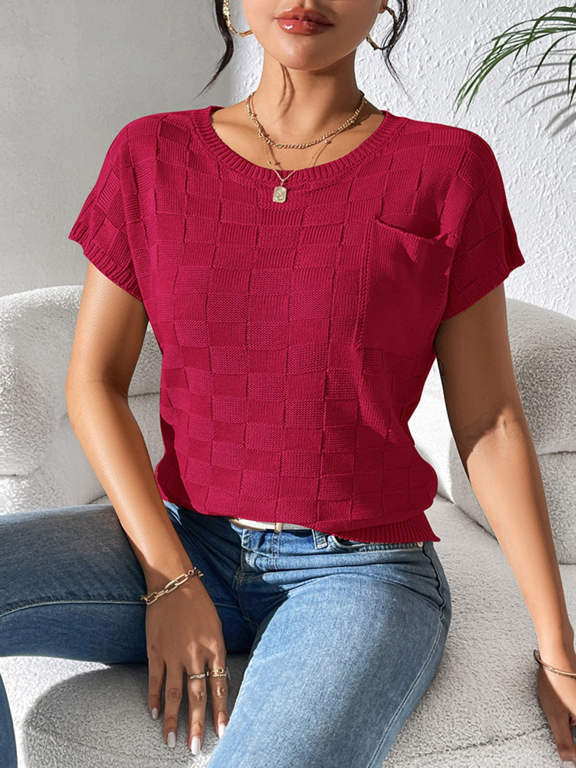 Burgundy textured knit pocket tee with crewneck and short sleeves.
