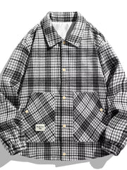 Men's black and white houndstooth button-up sport jacket with two chest pockets.