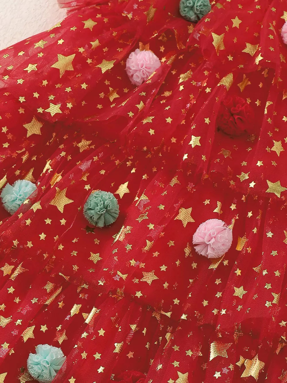 Red tulle baby dress with gold stars and colorful pom-poms