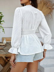 White Swiss dot blouse with smocked waist and ruffled cuffs