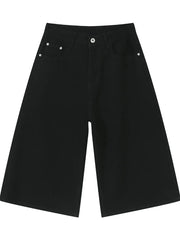 Black wide-leg denim culotte shorts with buttoned closure and front pockets.
